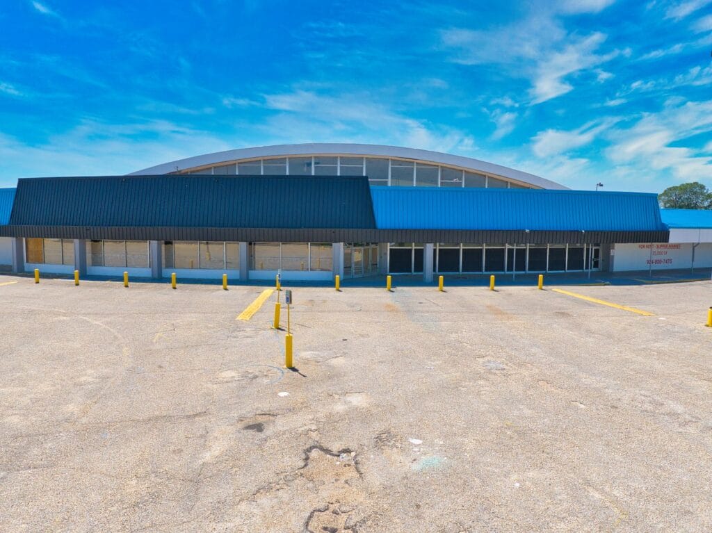 Exterior view of Normendale Shopping Center showcasing modern architecture and storefronts.
