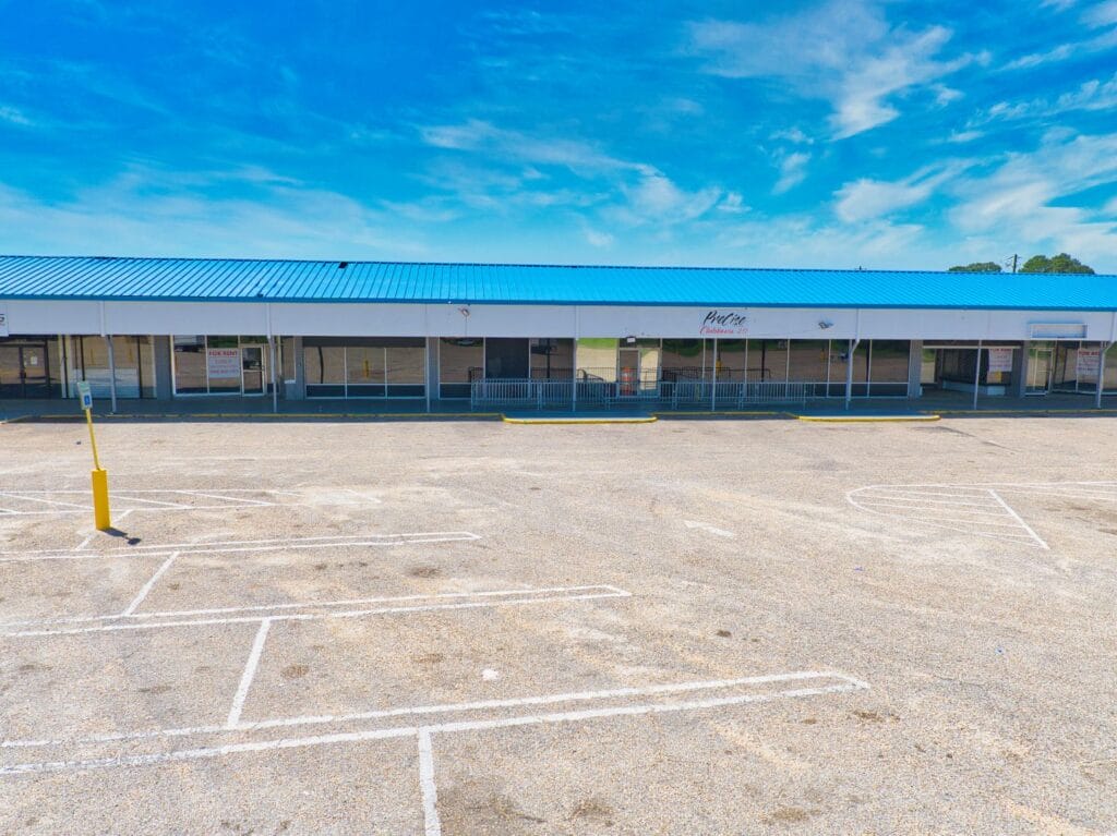 The Normendale Shopping Center features a modern storefront with large windows and a welcoming entrance, ideal for shopping.