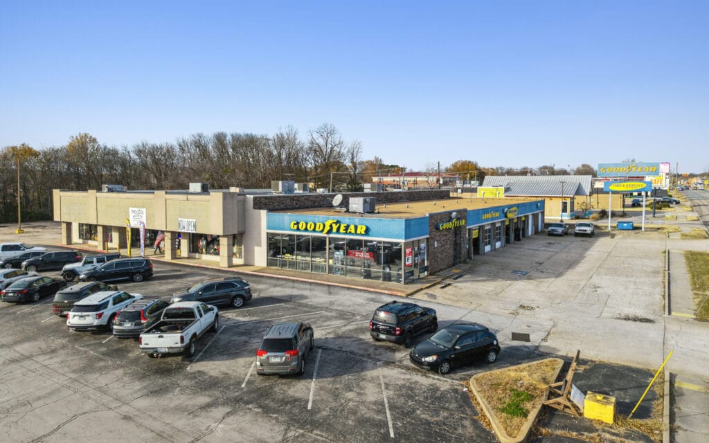 A retail center exterior showcasing modern architecture, with large windows and a welcoming entrance.