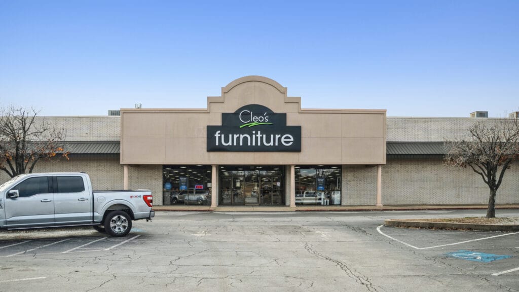 Exterior view of 407 N Arkansas Ave in Russellville, AR, showcasing the retail center's signage and architecture.