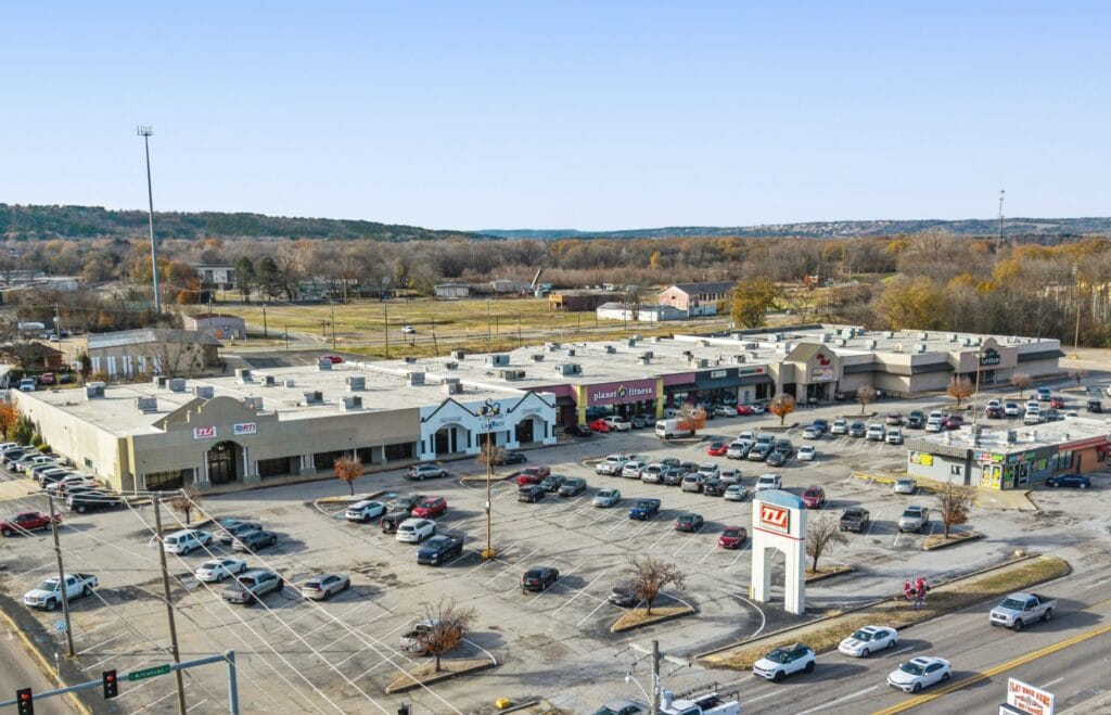 Exterior view of 407 City Mall showcasing modern architecture and vibrant storefronts in a bustling retail environment.