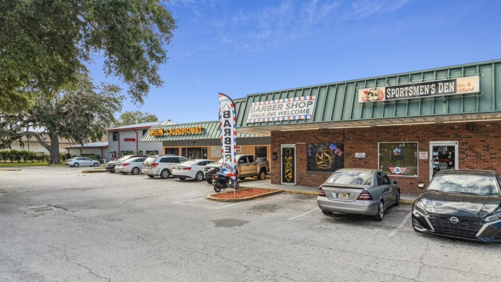 Exterior view of 1210 N Nova Rd in Daytona Beach, showcasing the building's architecture and surrounding landscape.
