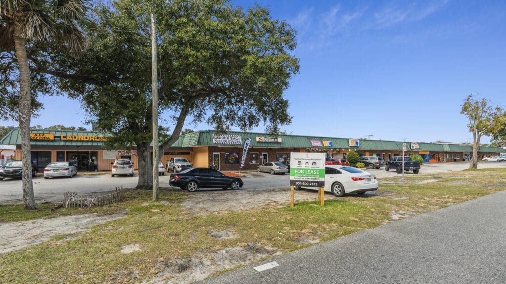 Exterior view of 1210 N Nova Rd in Daytona Beach, showcasing the building's architecture and surrounding landscape.