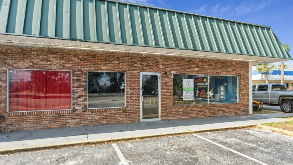 Exterior view of 1210 N Nova Rd in Daytona Beach, showcasing the building's architecture and surrounding landscape.