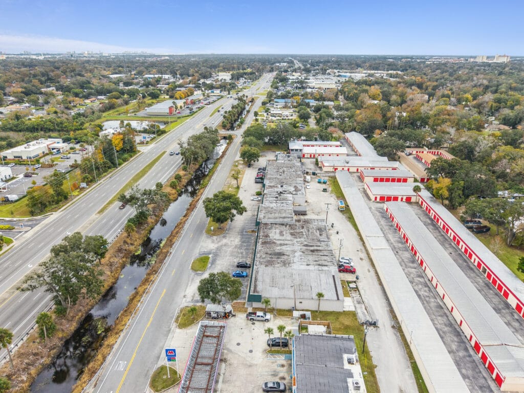 Exterior view of Daytona Plaza, showcasing the building's architecture and surrounding landscape in Daytona Beach, FL.