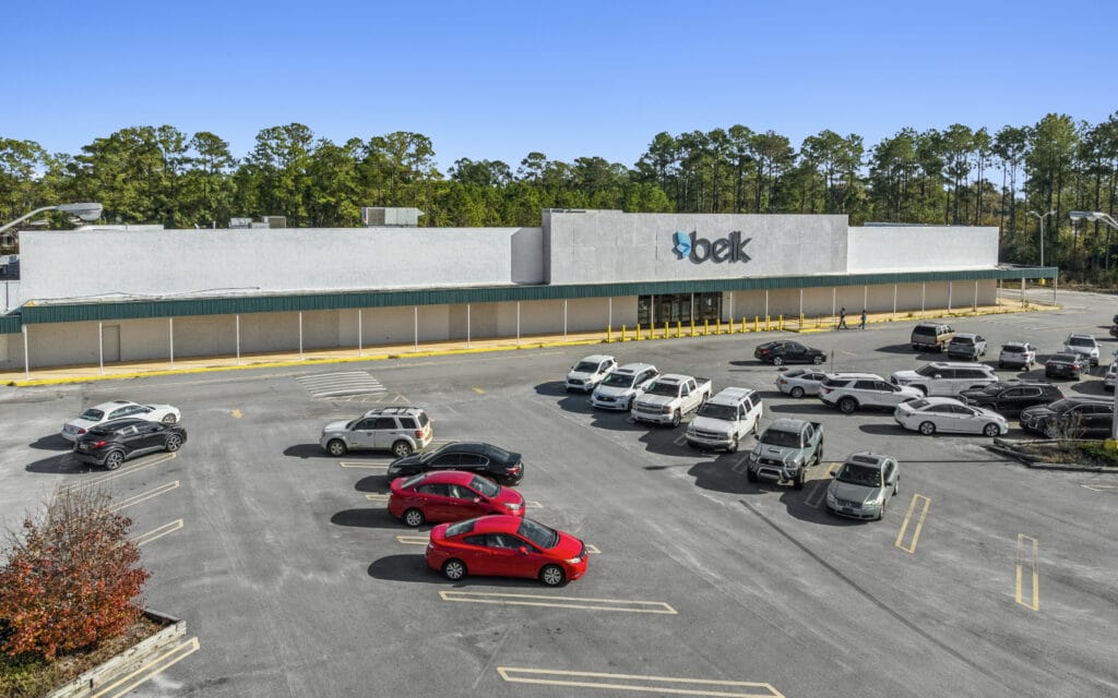 Exterior view of Sunset Plaza in Moultrie, GA, showcasing the building's architecture and surrounding landscape.