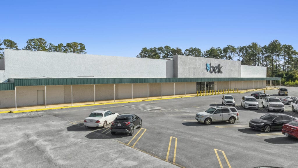 Exterior view of Sunset Plaza in Moultrie, GA, showcasing the building's architecture and surrounding landscape.