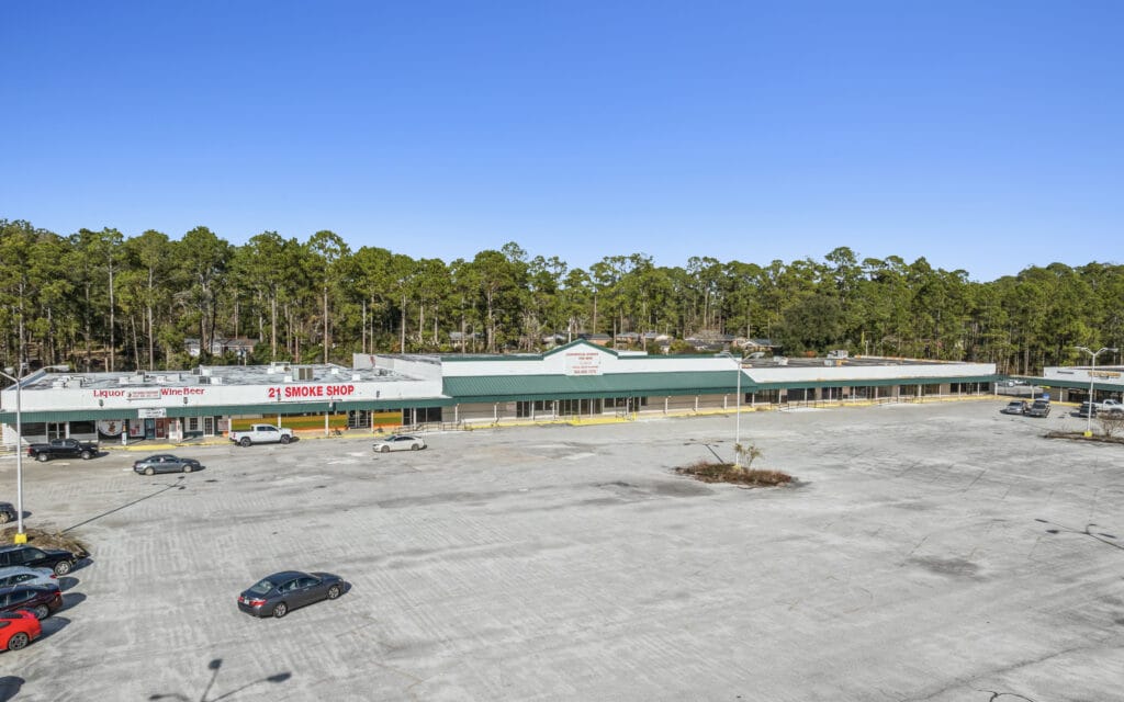 A spacious commercial property on S Main St in Moultrie, GA, showcasing a modern facade and ample parking.