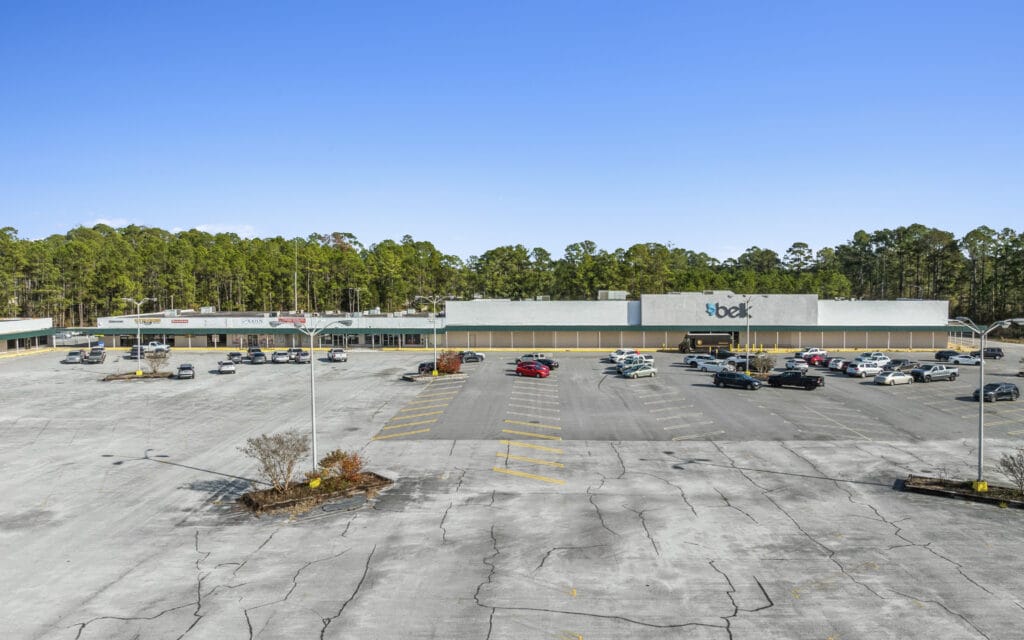 A spacious commercial property on S Main St in Moultrie, GA, showcasing a large building and ample parking.