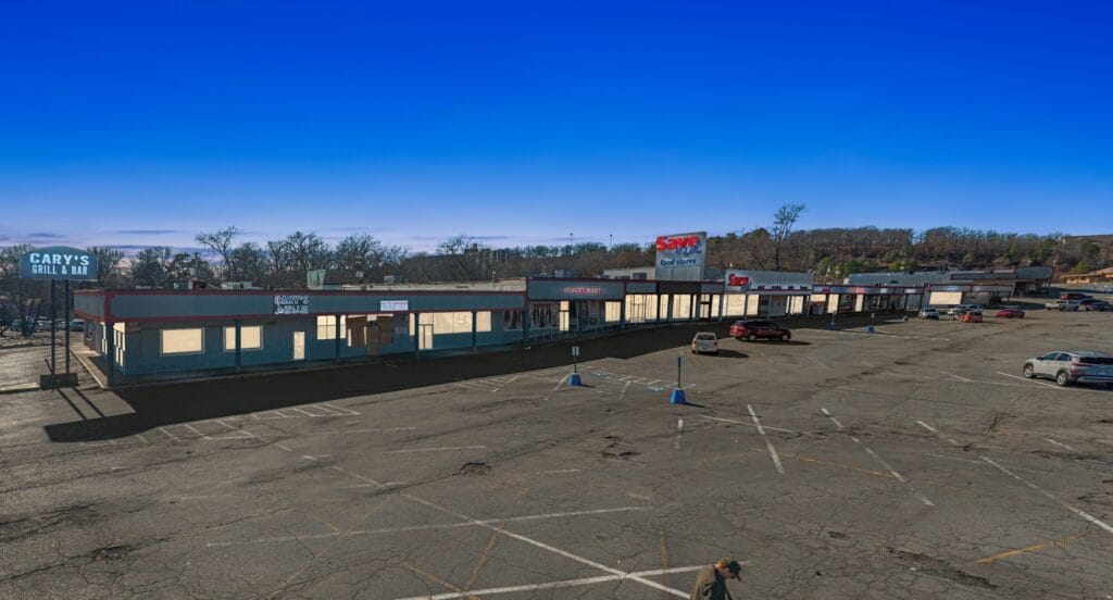 Exterior view of a commercial building at 2619 Pike Ave N, Little Rock, AR, showcasing its architecture and surroundings.