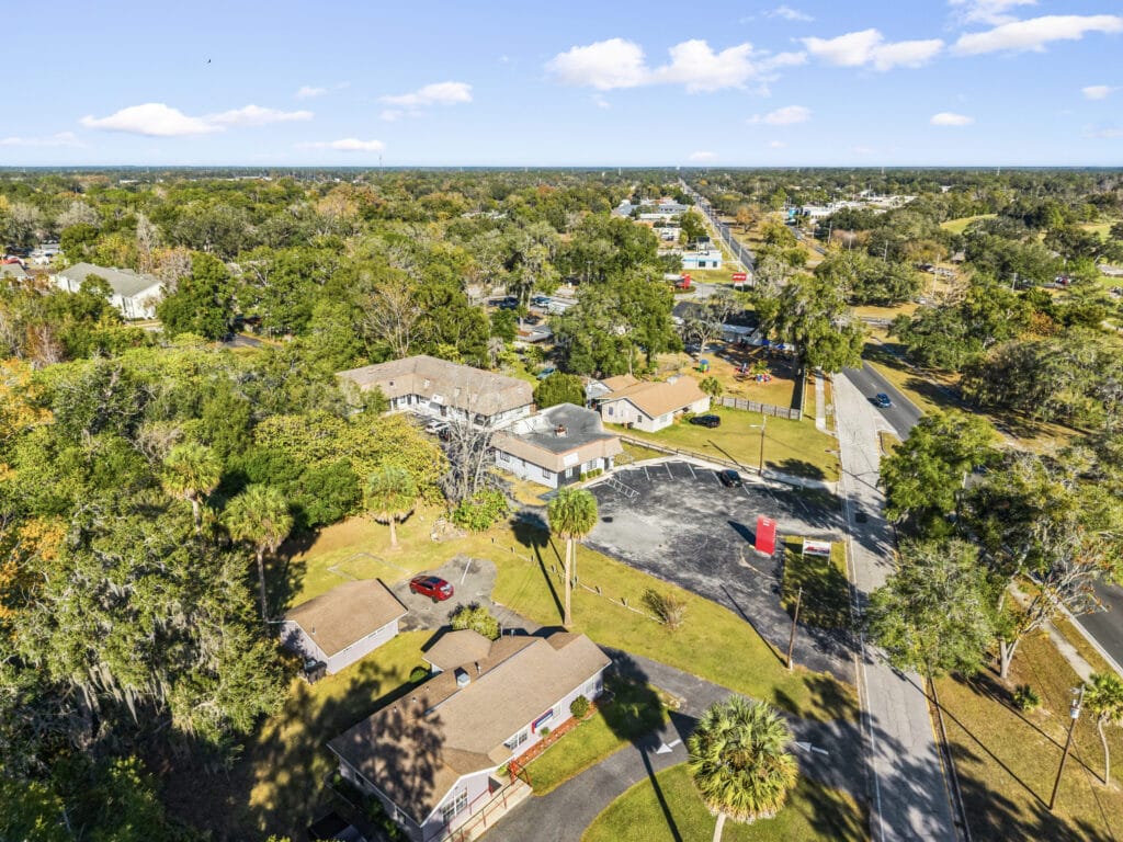 Exterior view of a residential property located at 2941 NE 3rd St, Ocala, FL, showcasing its landscaping and architecture.