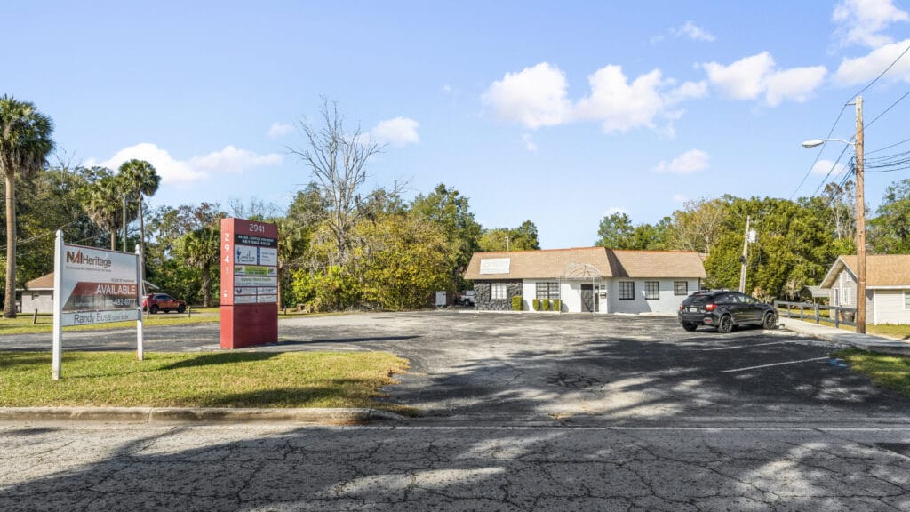Exterior view of a residential property at 2941 NE 3rd St, Ocala, FL, showcasing its architecture and landscaping.