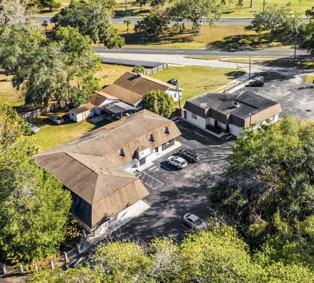 Modern residential property exterior in Ocala, showcasing a well-maintained lawn and inviting entrance.