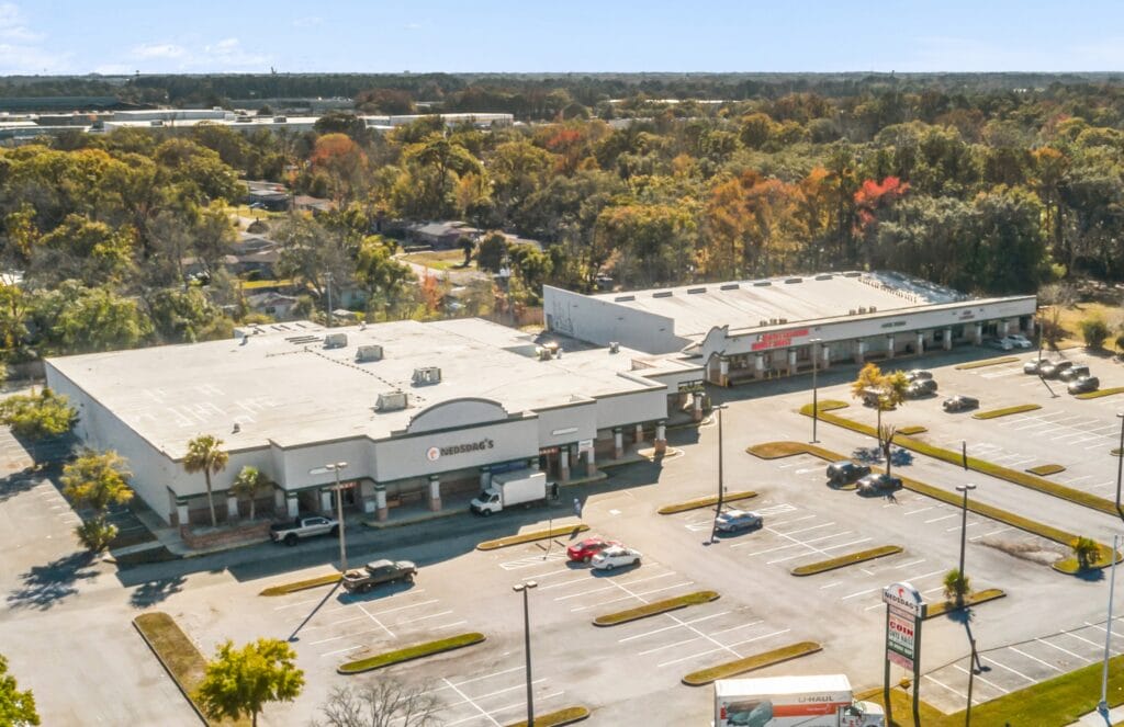 A modern apartment building at Edgewood Grande Plaza, showcasing elegant architecture and landscaping.