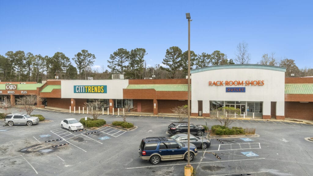 Exterior view of 3555 Mercer University Dr, showcasing a modern building with large windows and landscaping.