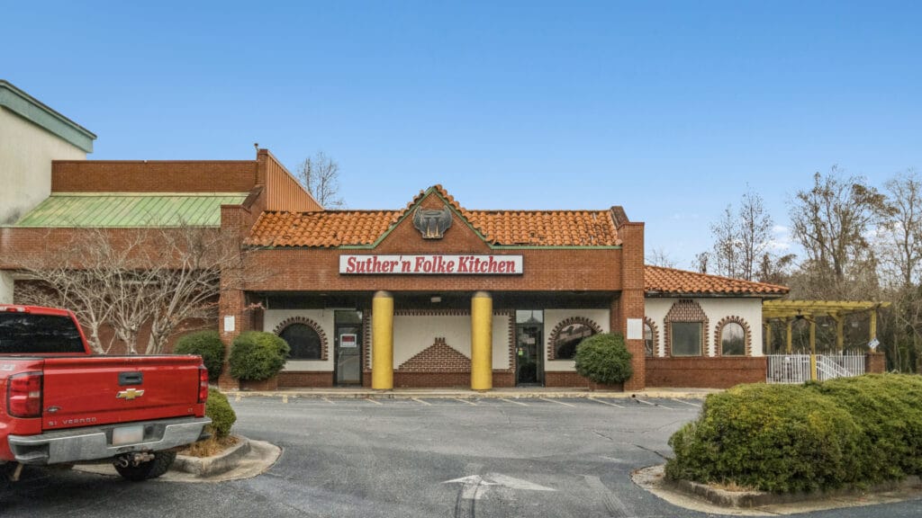 Exterior view of the property at 3555 Mercer University Dr, showcasing its architecture and surrounding landscape.