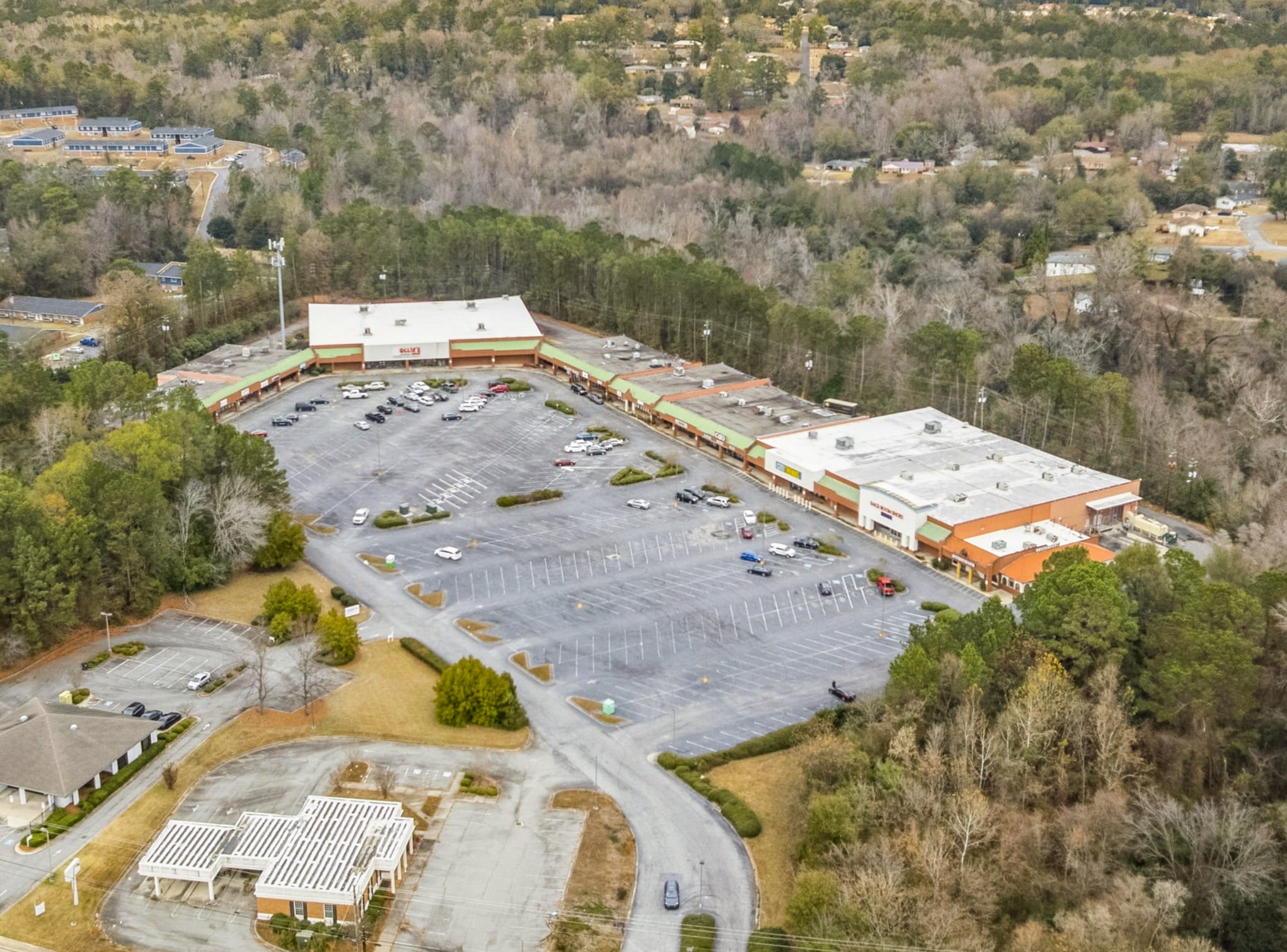 Exterior view of 3555 Mercer University Dr, showcasing a modern building with large windows and landscaping.