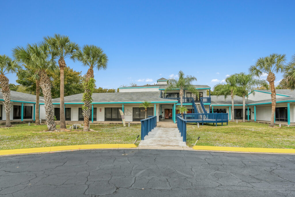 Exterior view of a commercial property at 39308 1128 Beville Rd, Daytona Beach, showcasing its architecture and surroundings.