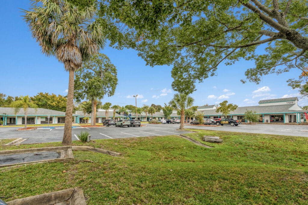Exterior view of 39308 1128 Beville Rd in Daytona Beach, showcasing a modern building with landscaping.