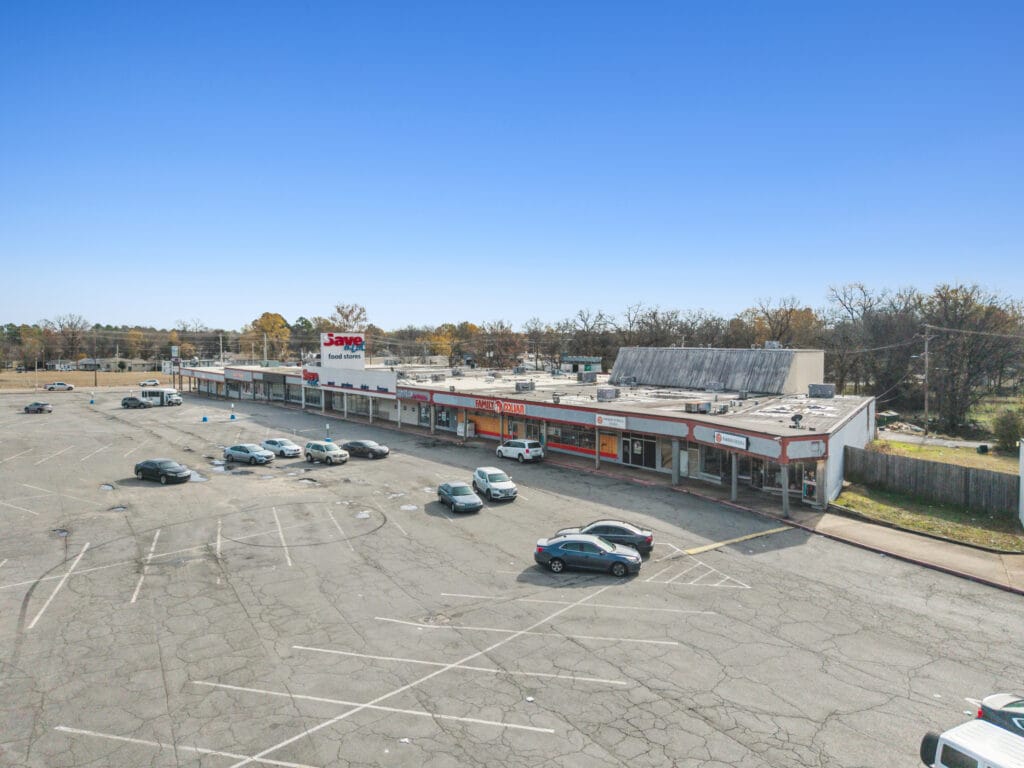 Exterior view of a commercial property at Pike Plaza, showcasing its modern architecture and surrounding landscaping.