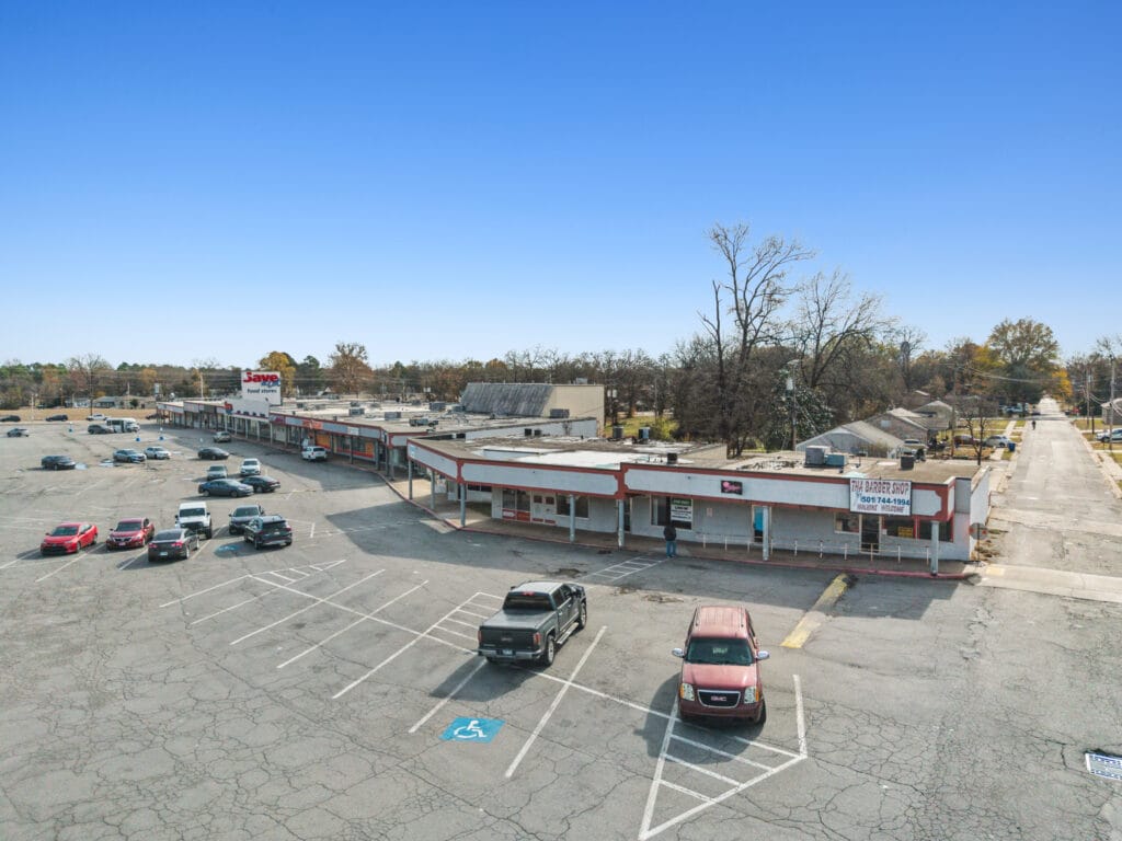 Exterior view of Pike Plaza, showcasing the building's architecture and surrounding landscape in Little Rock, AR.