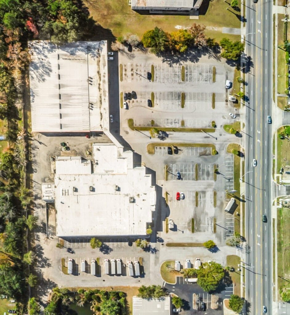 Exterior view of 40058 3118 Edgewood Ave W in Jacksonville, showcasing a modern building with landscaping.