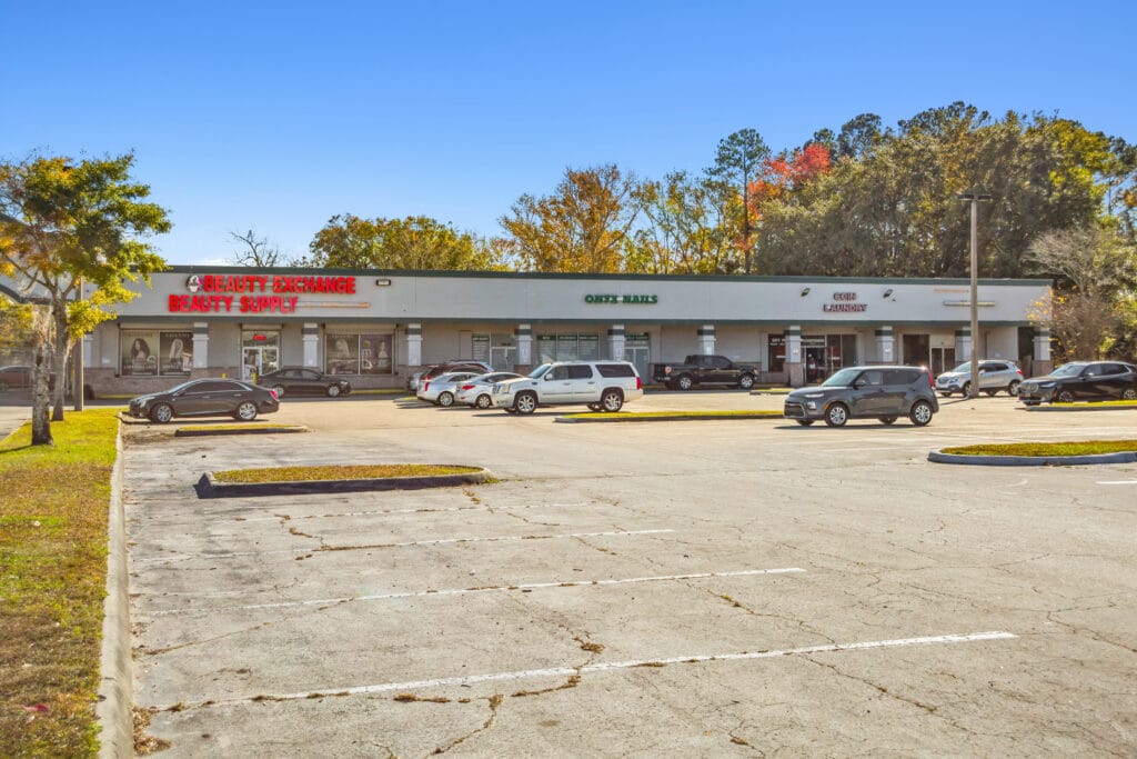 Exterior view of 40058 3118 Edgewood Ave W, showcasing the building's facade and surrounding greenery.