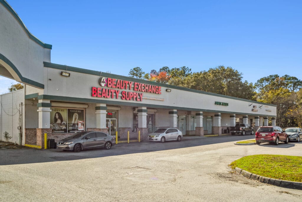 Exterior view of 40058 3118 Edgewood Ave W in Jacksonville, showcasing a modern building with landscaping.