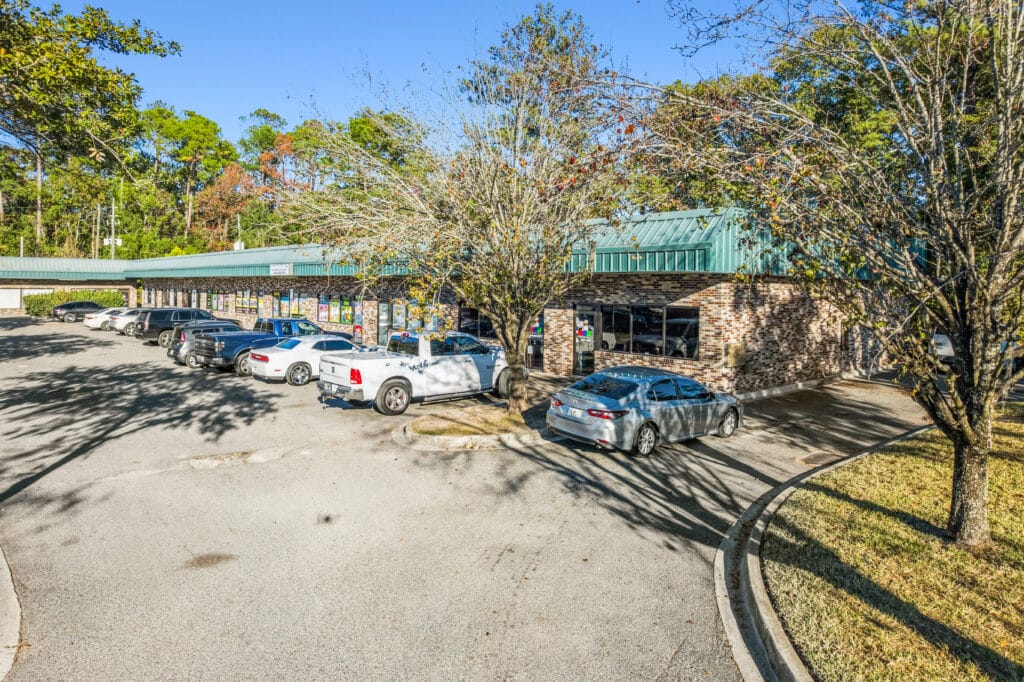 Exterior view of a commercial property at 2851 Edgewood Ave N, showcasing its modern architecture and surrounding landscape.