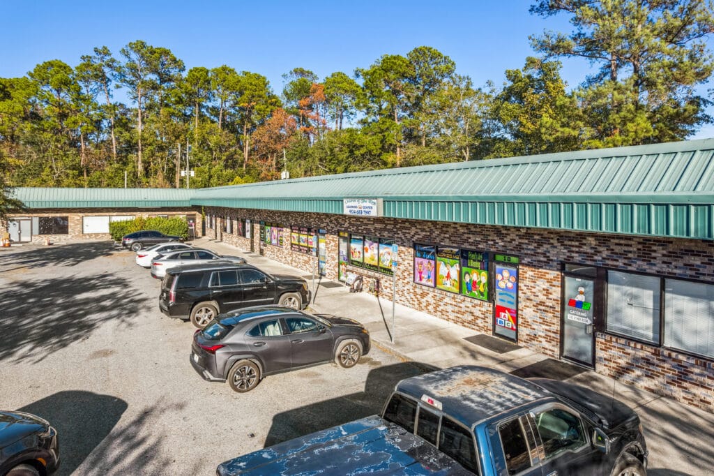 Exterior view of 40060 2851 Edgewood Ave N in Jacksonville, showing a modern building with landscaping.