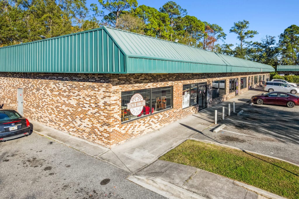 Exterior view of Edgewood Plaza, showcasing the building's architecture and surrounding landscaping in Jacksonville, FL.