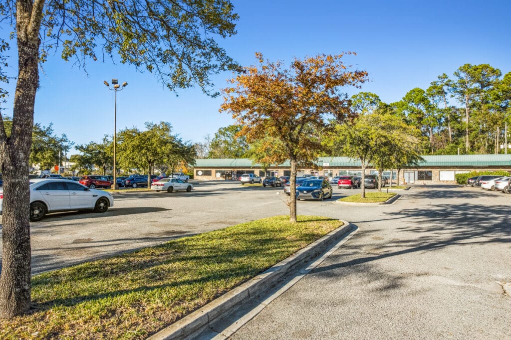 Exterior view of 40060 Edgewood Ave N in Jacksonville, showcasing the building's architecture and surrounding landscaping.