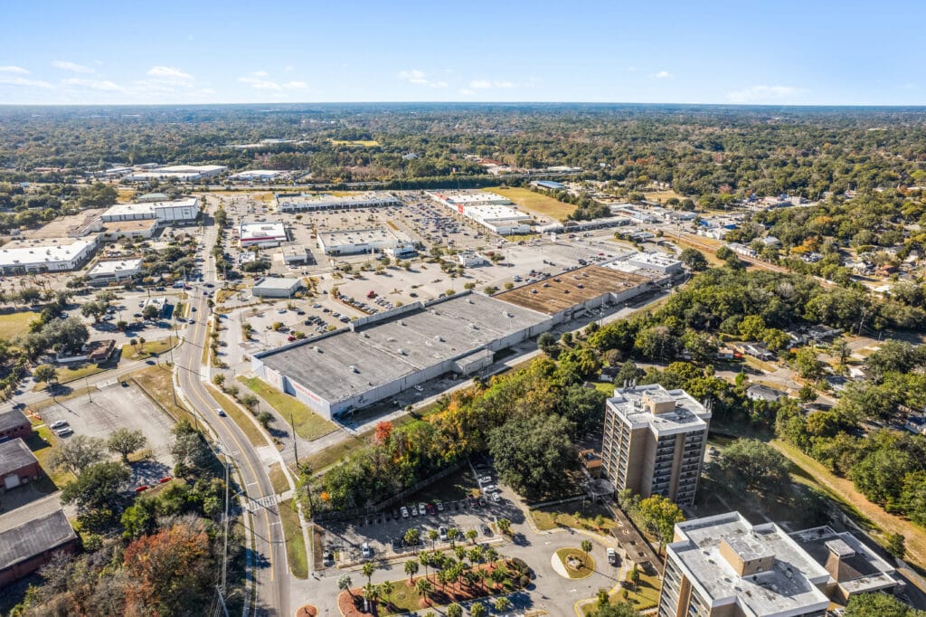 Exterior view of Norwood Plaza Flea Market in Jacksonville, featuring a large sign and parking area.
