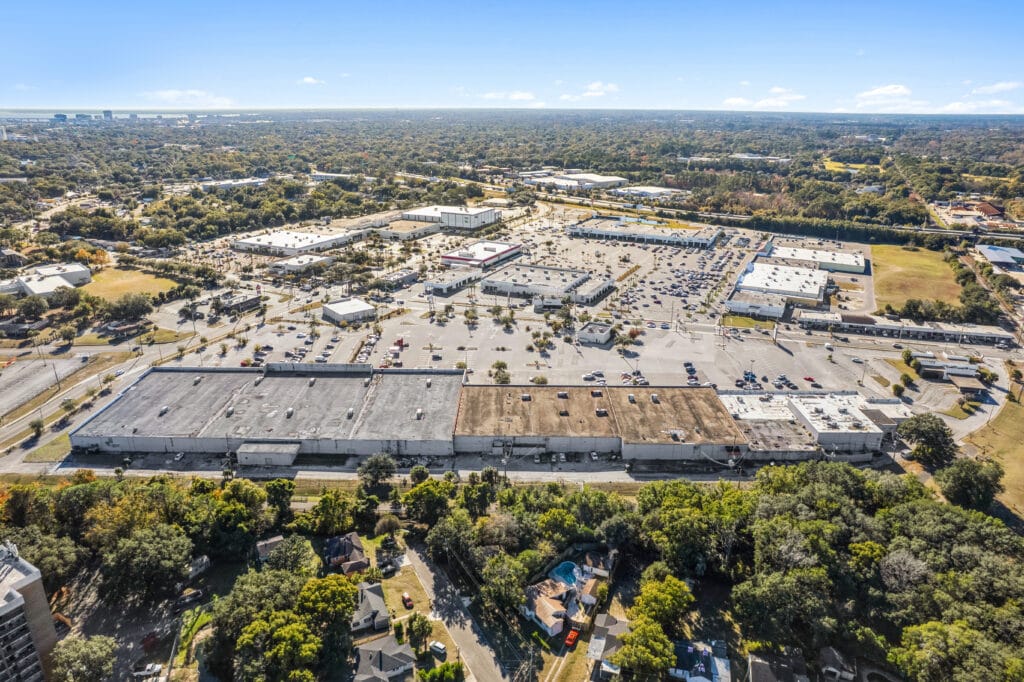 Exterior view of Norwood Plaza Flea Market in Jacksonville, featuring a large sign and parking area.