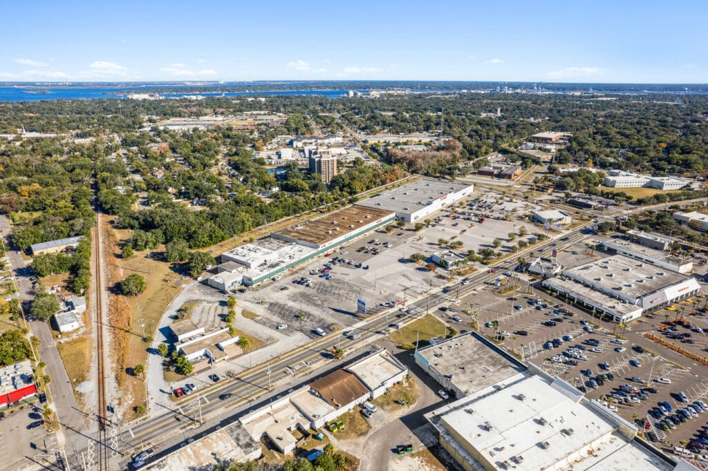 A view of the Norwood Plaza Flea Market in Jacksonville, showcasing various vendor stalls and shoppers browsing.