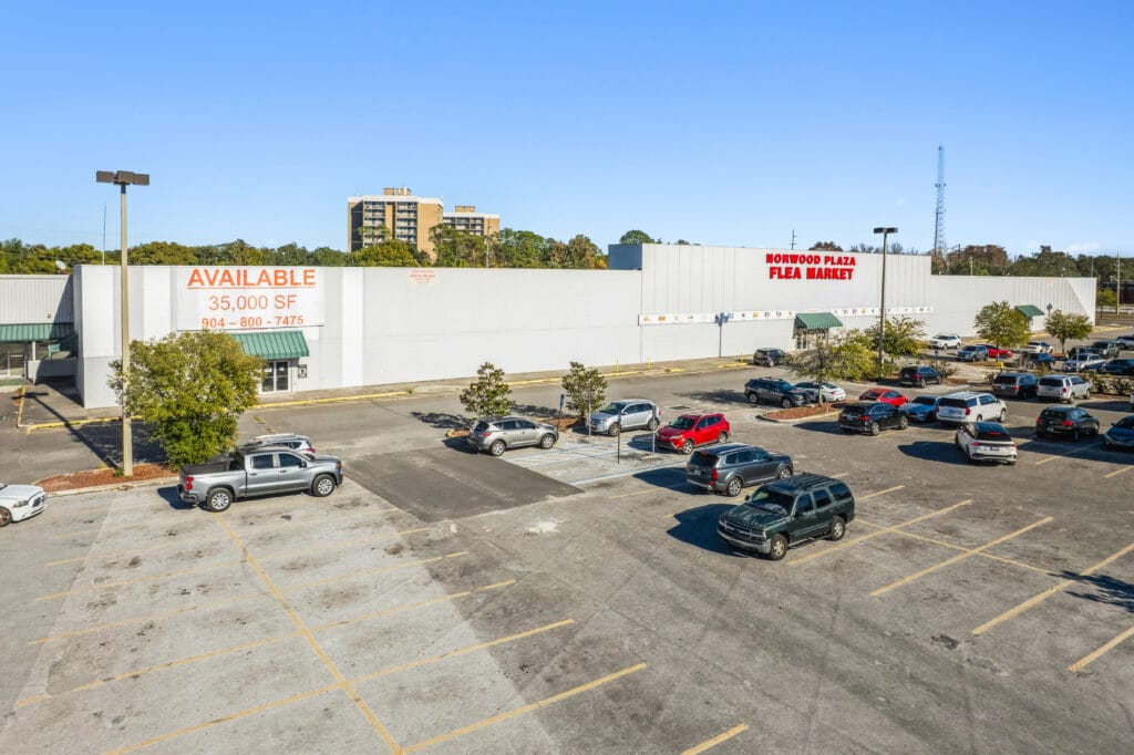 Exterior view of 5451 Norwood Ave, Jacksonville, FL, showcasing the Norwood Plaza Flea Market entrance.
