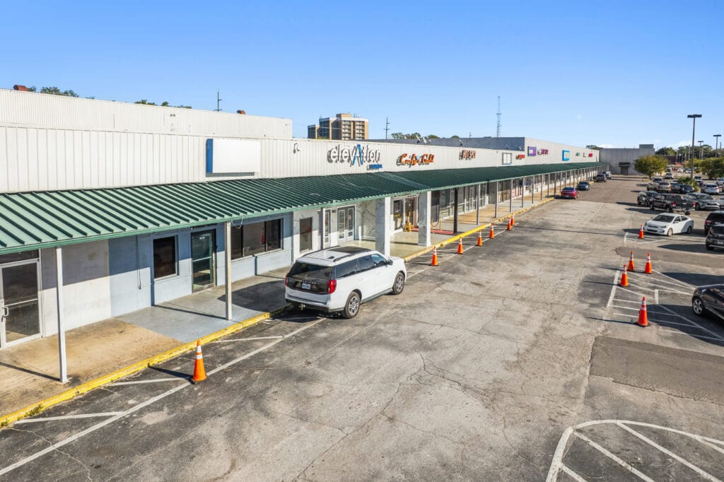 Exterior view of Norwood Plaza Flea Market in Jacksonville, showcasing the building's signage and surrounding area.