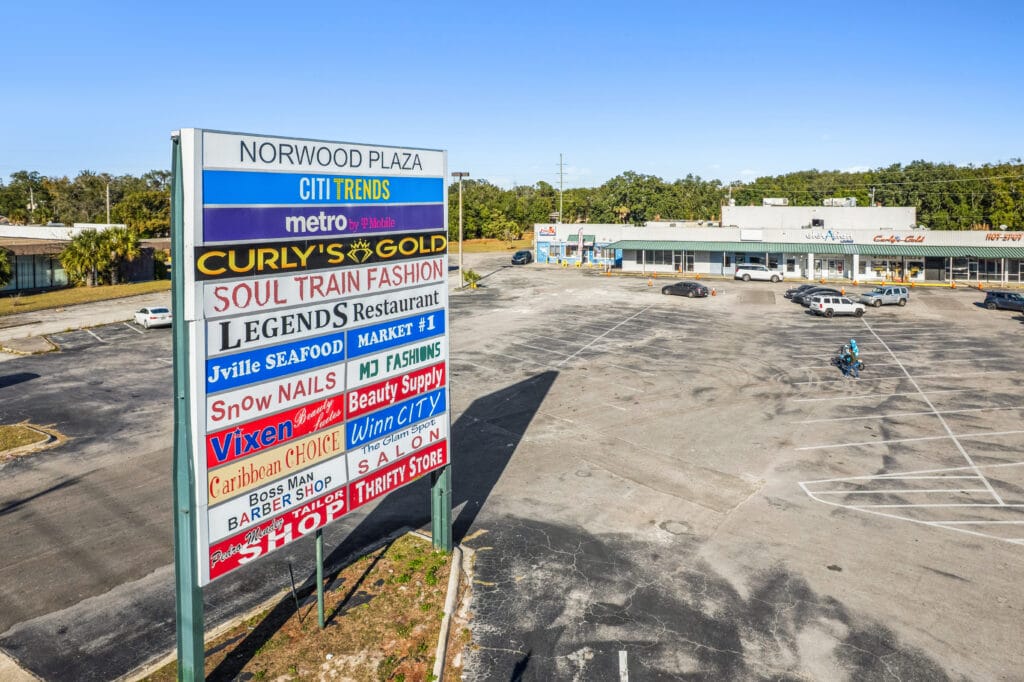 Exterior view of Norwood Plaza Flea Market in Jacksonville, showcasing the building's signage and surrounding area.