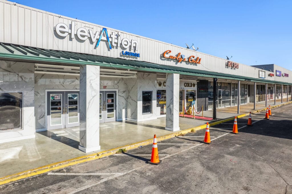 Exterior view of Norwood Plaza Flea Market in Jacksonville, showcasing the building's signage and surrounding area.