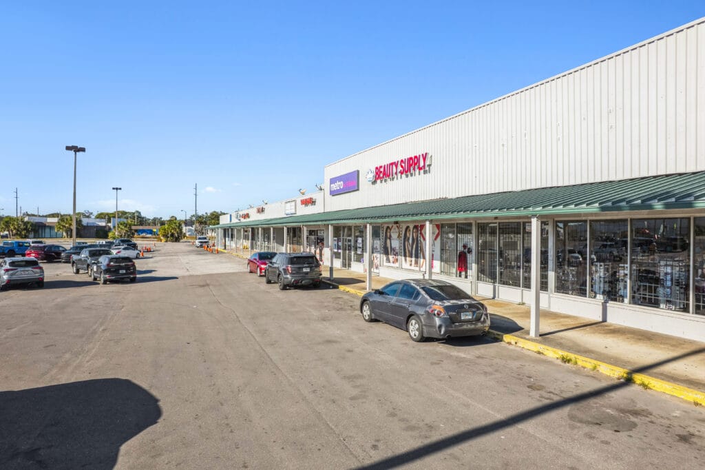 Exterior view of a commercial building at 5451 Norwood Ave, showcasing its signage and surrounding area.