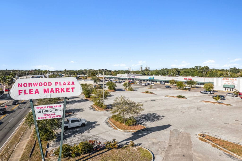 Exterior view of Norwood Plaza Flea Market in Jacksonville, showcasing the building's signage and surrounding area.