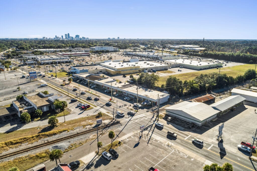 Exterior view of the Norwood Strip Mall, showcasing its storefronts and signage in Jacksonville, FL.