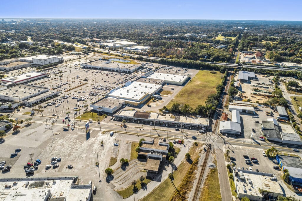 Exterior view of the Norwood Strip Mall at 5848 Norwood Ave in Jacksonville, showcasing storefronts and signage.