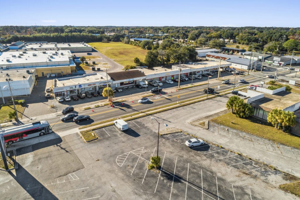 Exterior view of Norwood Strip Mall in Jacksonville, showcasing the building's architecture and surrounding landscaping.