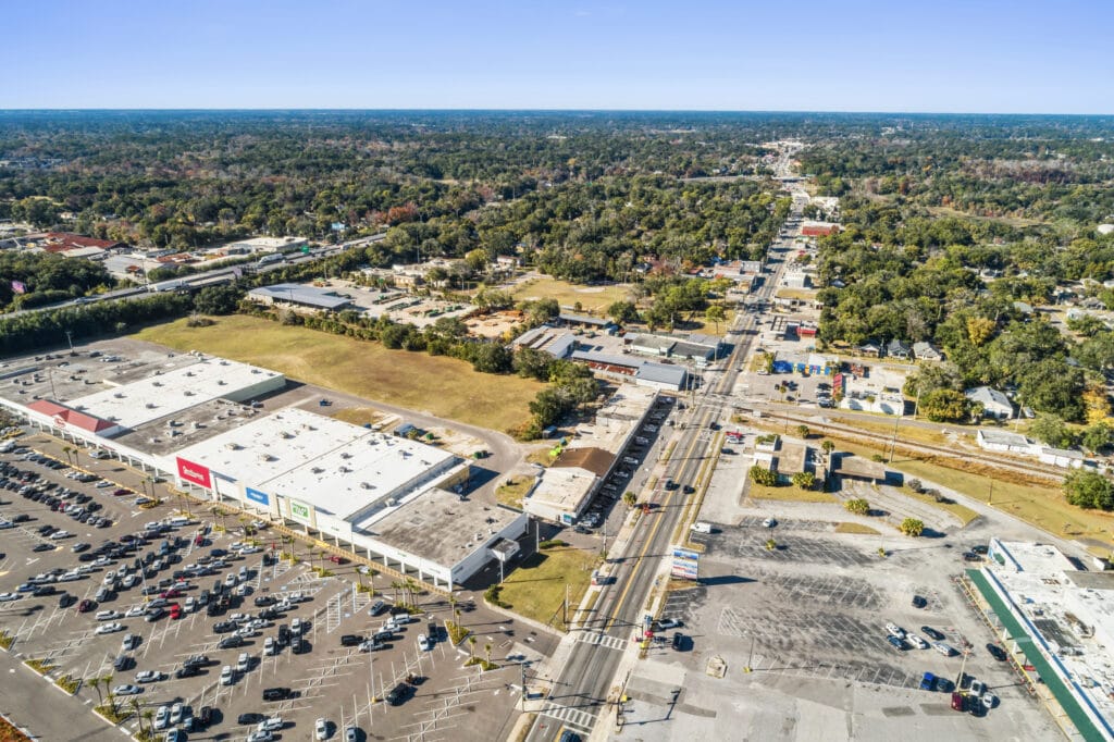 Exterior view of 5848 Norwood Ave, a commercial property in Jacksonville, showcasing its architecture and surroundings.