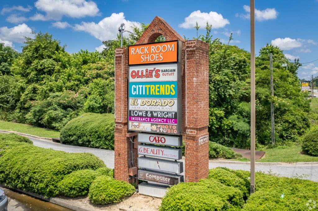 Exterior view of a modern building with large windows and a well-maintained landscape at 3555 Mercer University Dr, Macon, GA