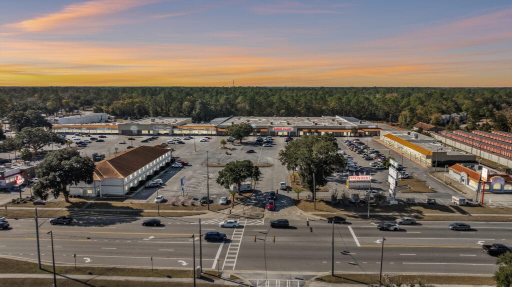 Exterior view of a commercial property at 229 W General Screven Way, showcasing its entrance and surrounding landscape.