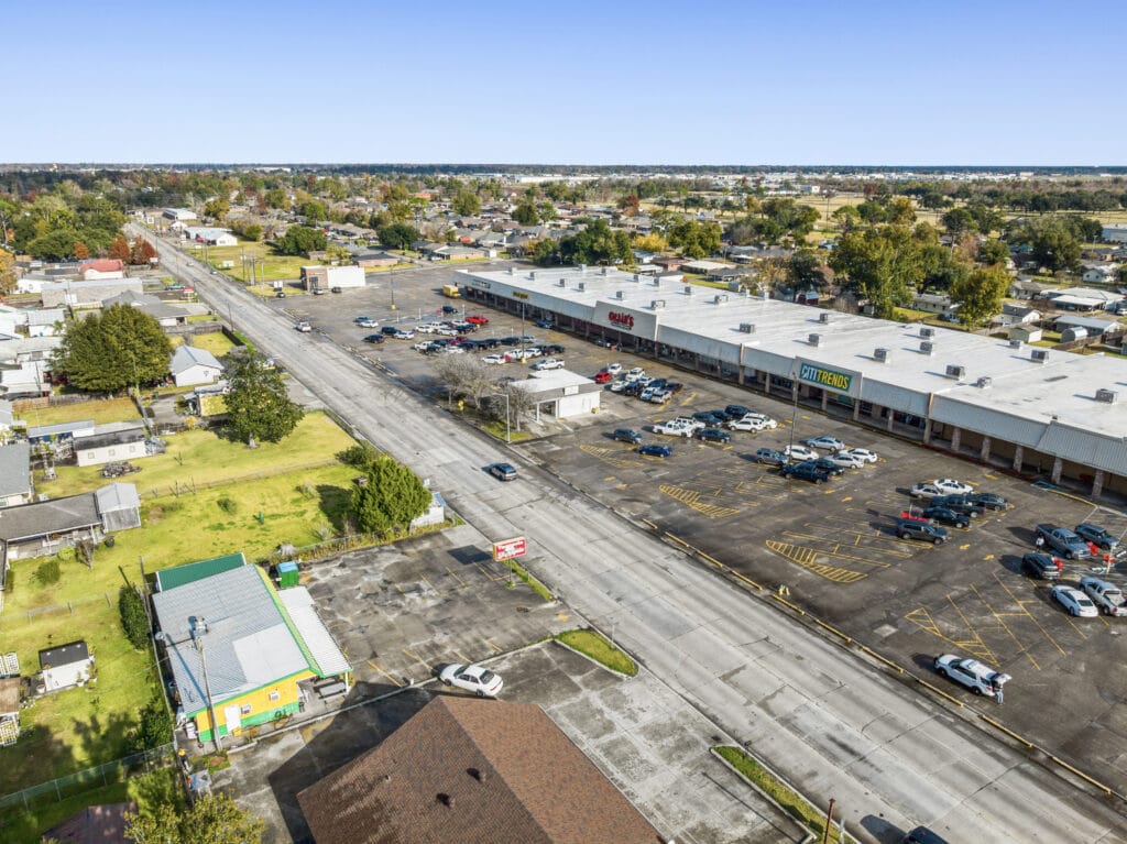 Exterior view of a large property located at 1221 Grand Caillou Rd, Houma, LA, showcasing a well-maintained lawn and surround