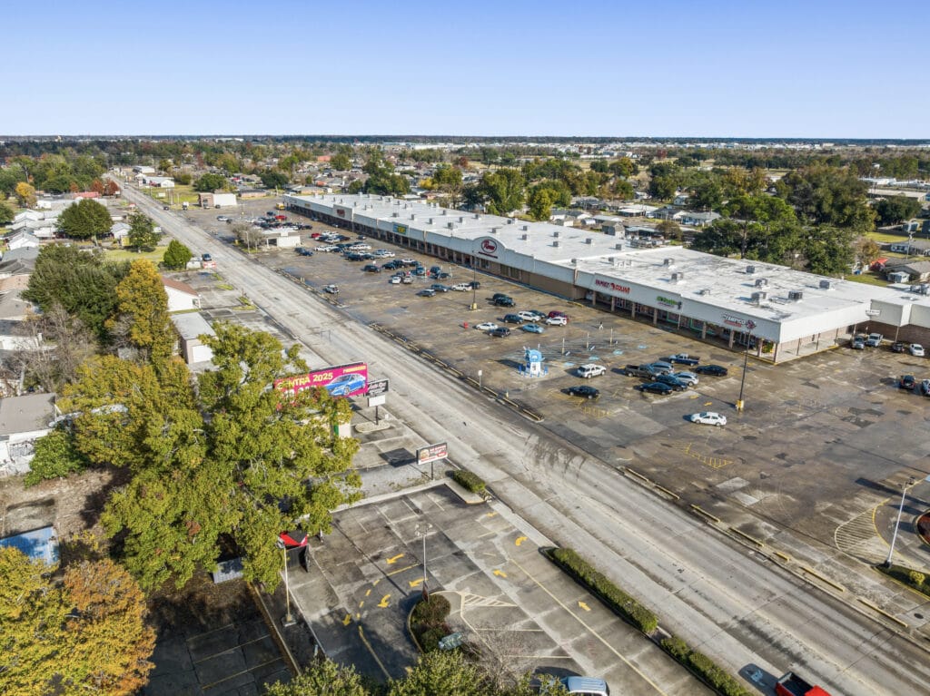 Exterior view of a commercial property at 1221 Grand Caillou Rd, Houma, LA, showcasing its architecture and surroundings.
