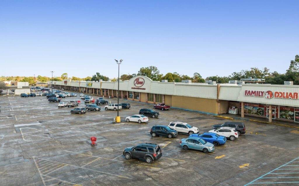 Exterior view of a commercial property at 1221 Grand Caillou Rd, Houma, LA, showcasing its architecture and surrounding area.